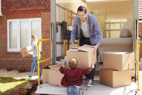 Professional man and van service handling furniture carefully