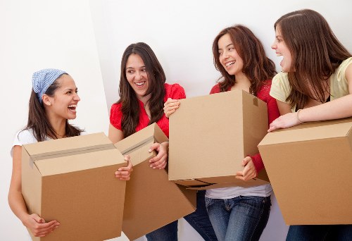 Removals team handling boxes and household items in Marks Gate