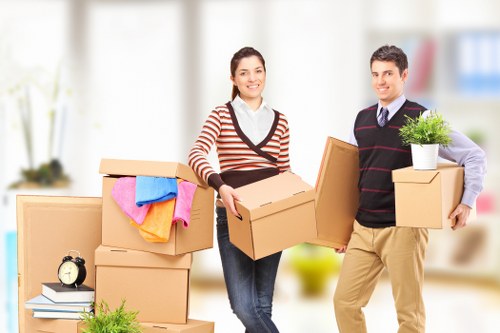 Packed boxes and furniture ready for local removals in Marks Gate