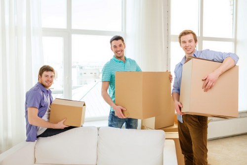 Local movers handling household items and furniture