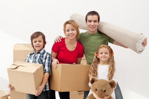 Furniture and household items being loaded into a van