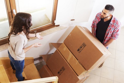 Local moving van loading boxes and furniture in Marks Gate