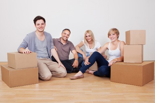 Packed moving boxes and furniture prepared for collection in Marks Gate